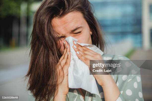 <p>runny nose</p><p>( I have a runny nose and I'm sneezing a lot. )</p>