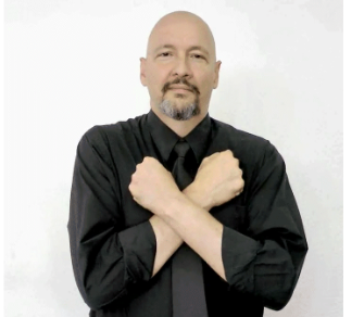 <p>fists cross at wrists and sit on chest</p>