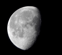 <p>less than full, more than half lighted; light from left</p>