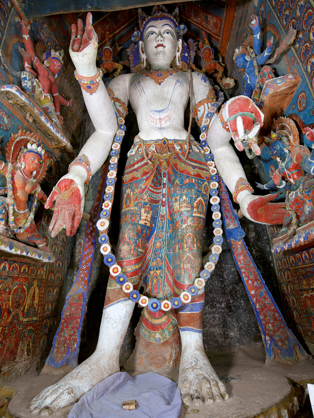 <ul><li><p>Wears Five Buddha Crown</p></li><li><p><span style="background-color: transparent;">Compassion</span></p></li><li><p><span style="background-color: transparent;">Dhoti with holy sites in Kashmir → appears in the world to provide help to people</span></p><ul><li><p>evidence of deep Kashmiri connectio</p></li></ul></li><li><p><span style="background-color: transparent;">Body (of mind, body, speech triad)</span></p></li><li><p><span style="background-color: transparent;">Amitabha</span></p></li><li><p><span style="background-color: transparent;">west</span></p></li></ul><p></p>