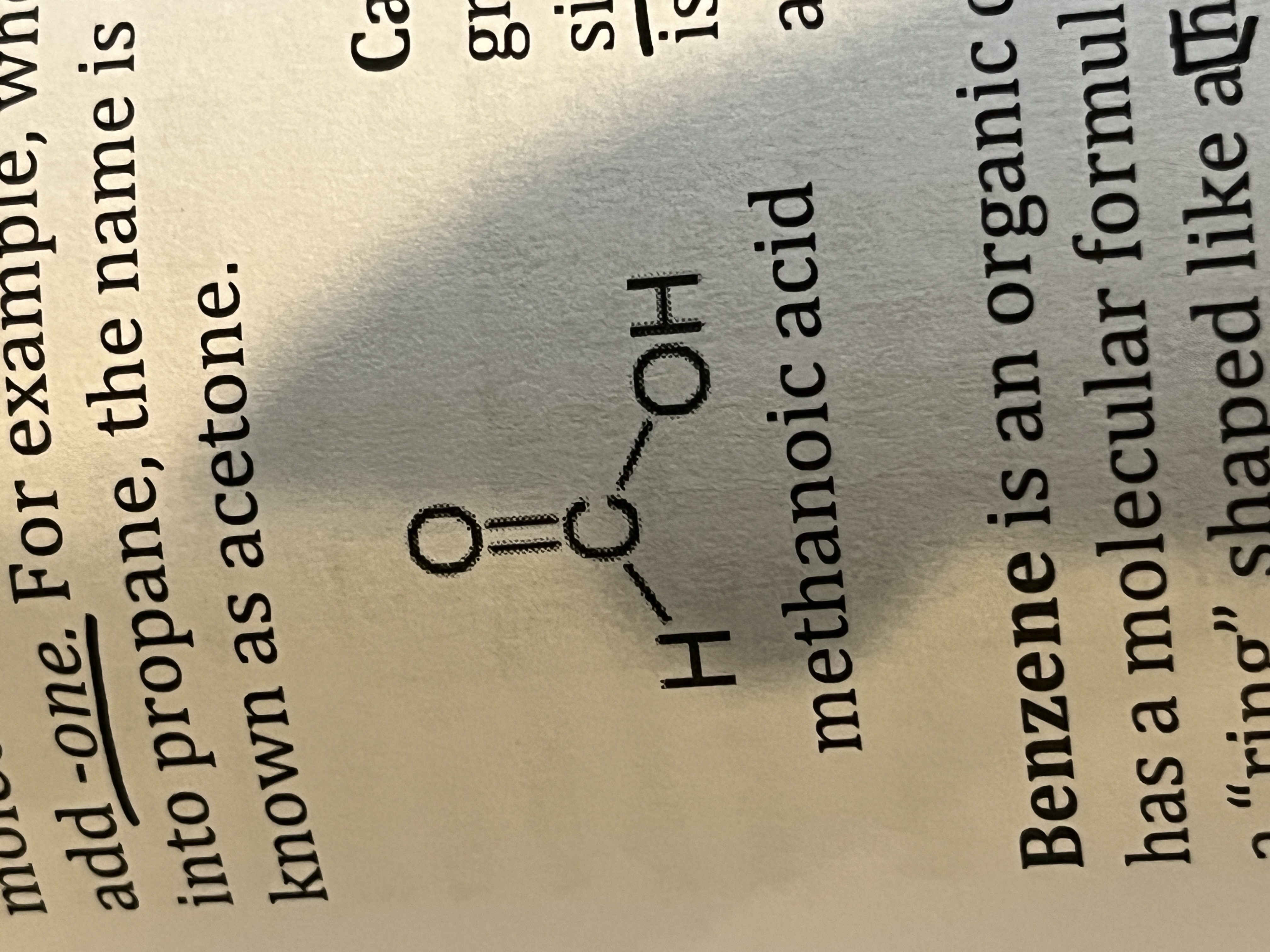 <p>An organic compound with a carbon atom double bonded to an oxygen and single bonded to a hydroxyl (-OH) </p><p></p>