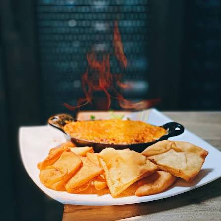 <p> Claw Crab Meat, Cheddar and Cream Cheeses, Garlic-Crab Seasoning Naan Chips, Flambéed Tableside with Brandy, Rosemary Sprig</p>