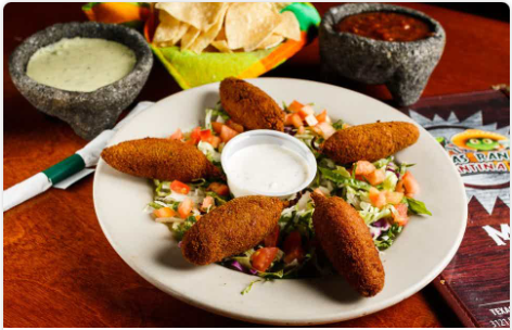 <p>(5) Jumbo jalapenos stuffed with (3) types of cheese and bacon, breaded, and deep-fried. Served with ranch dressing.</p>