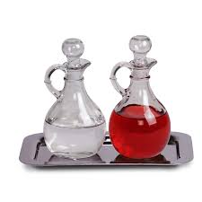 <p>small glass or metal container that holds wine or water for Mass</p>