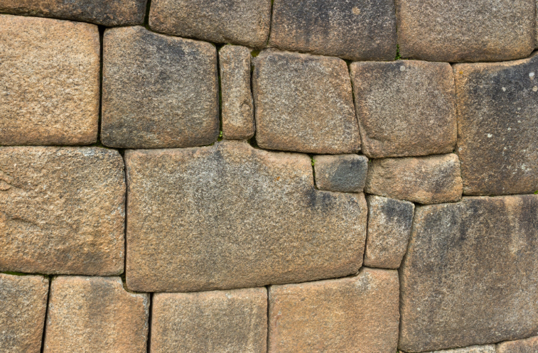 <p>finely cut, smooth, rectangular stone blocks that are all uniform in size and laid in even, regular rows with very thin joints. ( examples like: the Parthenon )</p>