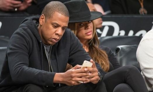 <p>She caught him <strong>snooping on</strong> her phone.</p>