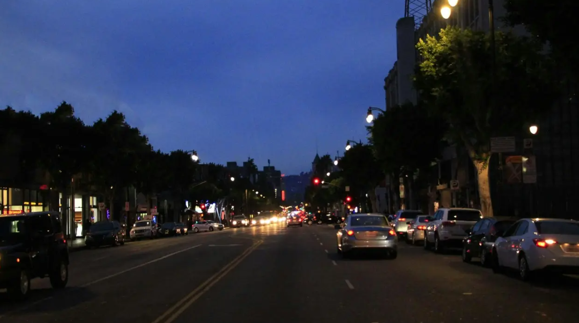 <p>Should you use low-beam headlights at night even on well-lit streets?</p>