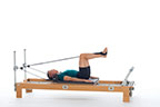 <p><strong>Setup</strong></p><ul><li><p>Lying supine in neutral spine position, hips externally rotated, feet in straps, dorsiflexed, heels together, hips and knees at 90 degrees</p></li><li><p>Resistance: light to medium | <strong>Springs: 1B or 1R</strong></p></li></ul><p><strong>Movement</strong></p><ul><li><p>Exhale: Straighten legs</p></li><li><p>Inhale: Bend legs, return to start position</p></li></ul><p><strong>Muscle Focus</strong></p><ul><li><p>Hip adductors</p></li><li><p>Hip extensors</p></li><li><p>Knee extensors</p></li></ul><p><strong>Objectives</strong></p><ul><li><p>Hip adductor control</p></li><li><p>Hip extensor control</p></li><li><p>Knee extensor control</p></li><li><p>Pelvic lumbar stabilization</p></li></ul><p><strong>Cues</strong></p><ul><li><p>Keep squeezing heels together</p></li><li><p>Avoid bending knees beyond 90 degrees</p></li><li><p>Keep heels traveling along horizontal line</p></li><li><p>Maintain pelvic lumbar stabilization</p></li></ul><p></p>