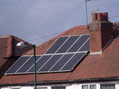 <p>a panel designed to absorb the sun's rays as a source of energy for generating electricity or heating.</p>