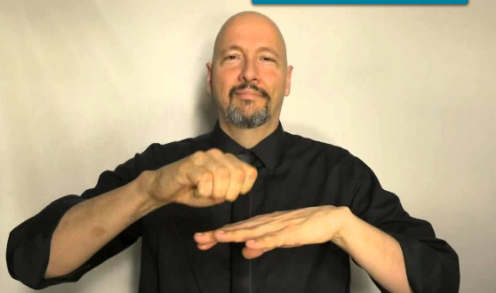 <p>dom hand slides ring onto non dom ring finger of non dom hand that is faced down OR dom hand circles as an “e” around ring finger</p>