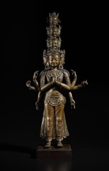 <p>A teacher displays a sculpture of a richly adorned Bodhisattva. Which characteristic distinguishes many Bodhisattva images from Buddha images?</p>