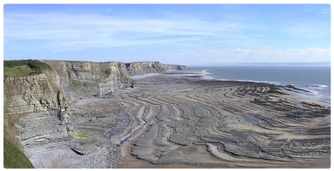 <p>Southern down, South Wales</p><p>In the last 200 million years, earth movements creating folding and fracturing of rocks. High waters mostly since the end of the last Ice Age has meant the present coastline resumes a fast pace of erosion, creating a long wave-cut platform</p>