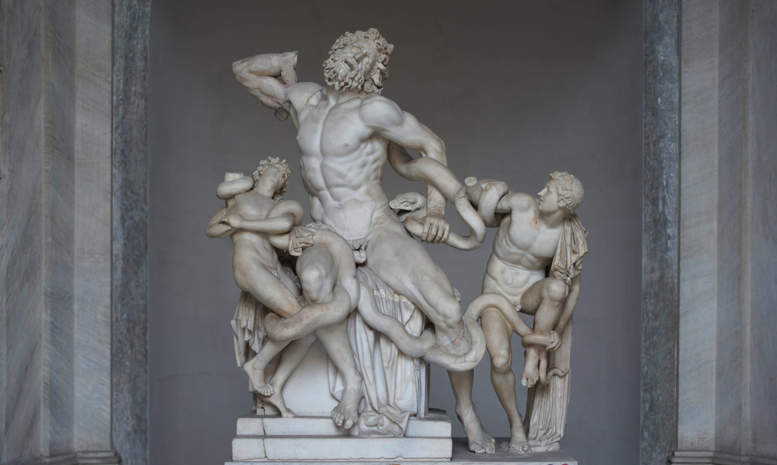 <p>found in 1506, on Esquiline Hill, <span>depicts the agonizing death of the Trojan priest Laocoön and his two young sons, Antiphantes and Thymbraeus, as they are attacked by giant sea serpents.  </span>bought by Pope Julius II, influenced the slaves for Michelangelo’s tomb of Julius II</p>