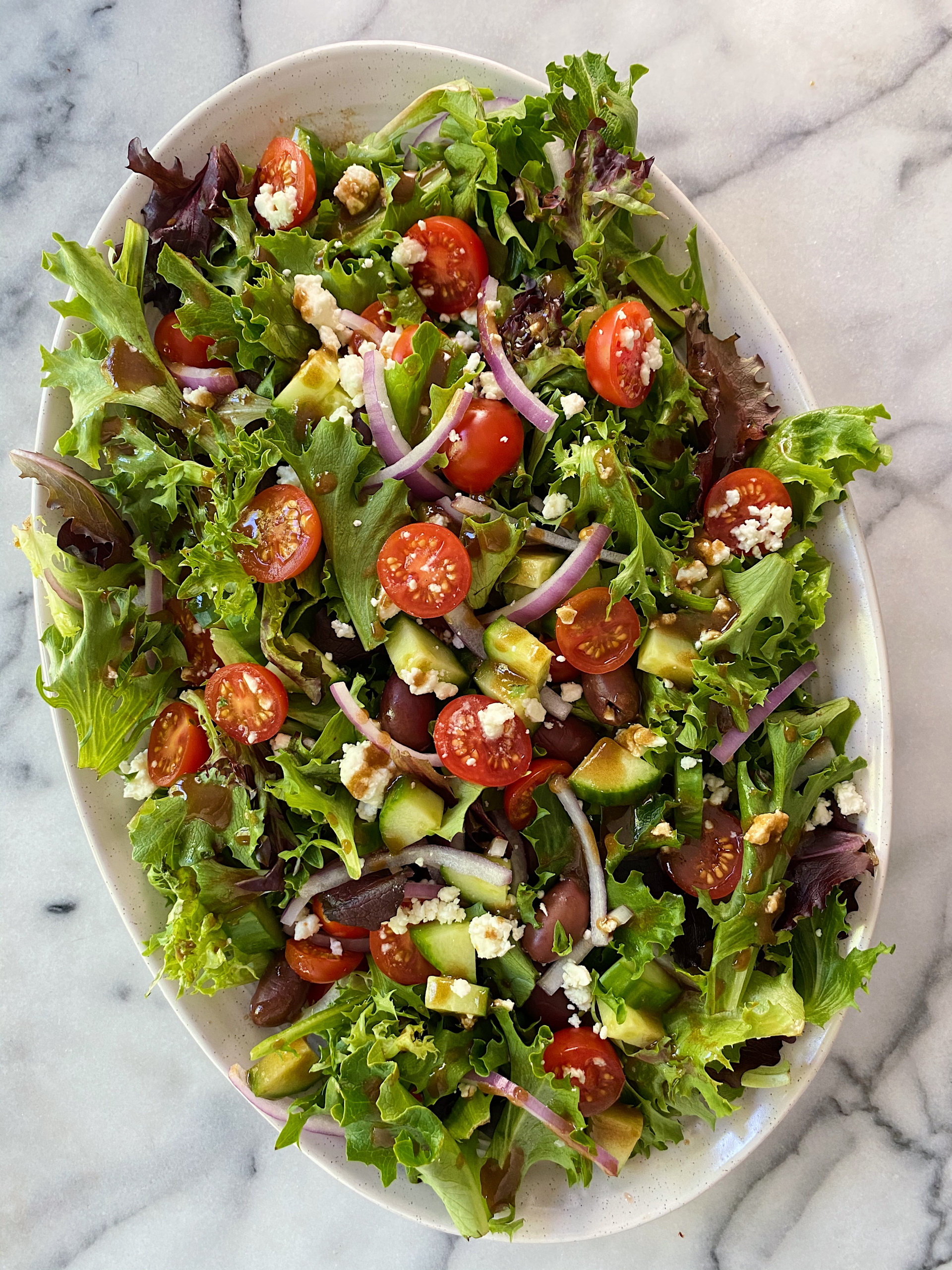 <p>A dish composed of various mixtures of raw or cooked vegetables, usually seasoned with dressing.</p>