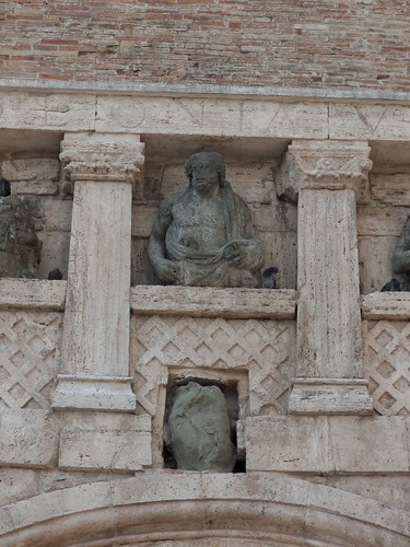 <p>Etruscans are credited for creating the <span><strong>first arch-shaped gateway</strong></span> that you’ll see later will become a major type of architecture in Roman Art and beyond. The use of trapazoidal stones called <em>voussoirs</em> put pressure on its neighboring stone, resulting in an arch that's stable and strong, as the weight is not just pressing down the middle, but distributed along the sides as well, not unlike the concept of the corbel arch, but with less of a point.</p><p>This arch-shaped gateway was framed with fluted, flat Greek-style pilasters that are engaged. Roman mythological figures including Jupiter (aka Zeus) and his sons fill the niches.</p>