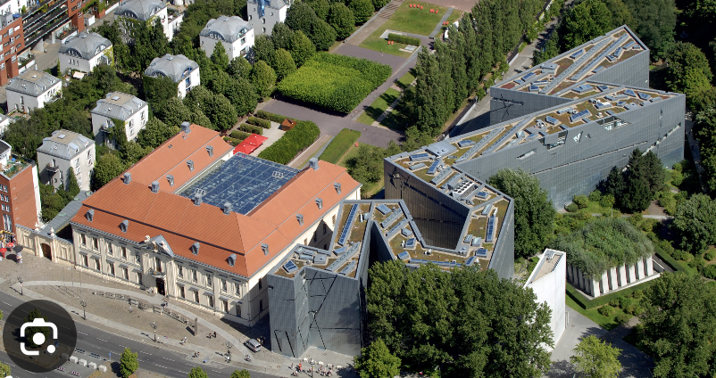 <p>Berlin, Jewish Museum, 1992-1998, arch.: Daniel Libeskind</p><ol><li><p><span><strong>Embodiment of Absence (The Voids):</strong> The design incorporates a central, empty "void" cutting through the entire building, physically representing the destruction and erasure of Jewish life in Berlin.</span></p></li><li><p><span><strong>Narrative of Traumatic History:</strong> Its zig-zag structure, crossed by the straight "Axis of the Holocaust" and "Axis of Exile," forces a physical engagement with the interrupted narratives of German Jews.</span></p></li><li><p><span><strong>Emotive Visitor Experience:</strong> Libeskind used intentional discomfort—slanted walls, echoing spaces, and lack of traditional pathways—to create an emotional, subjective experience rather than just an exhibition space.</span></p></li></ol><p></p>