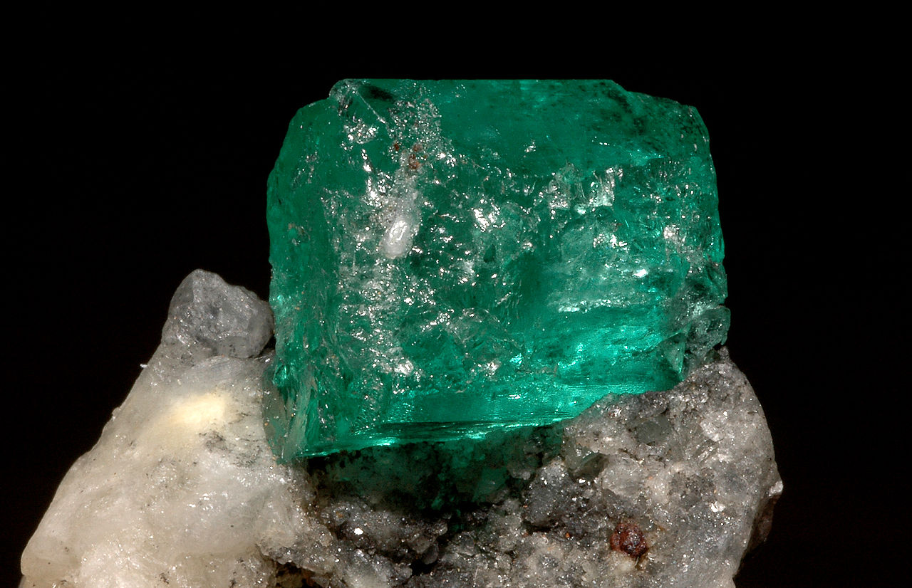 <p><strong>Emerald</strong>, the green variety of beryl, owes its color primarily to the presence of which ions?</p>
