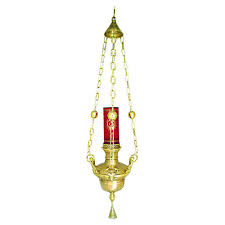 <p>candle kept burning near the tabernacle as a sign of honor and to remind us of the presence of Jesus un the Blessed Sacrament</p>