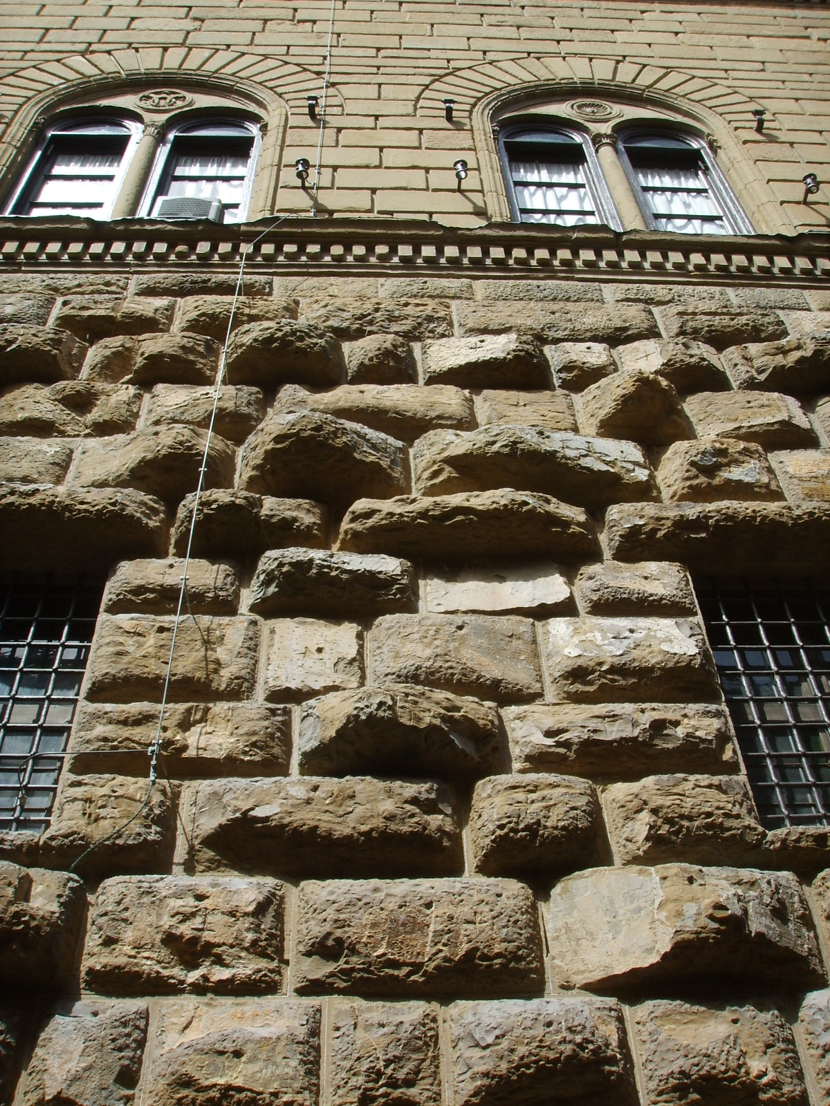 <p>technique where stone blocks are cut with rough, textured, or deeply recessed edges/surfaces (instead of smooth and flat) to make a building's exterior look bold, heavy, and fortress like</p>