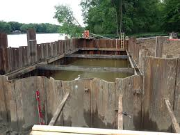 <p>a cofferdam is a substantially water tight enclosure consisting of steel sheet piling and structural bracing components which will permit substructure construction in waterways, or other areas where construction must be isolated from the surroundings </p>