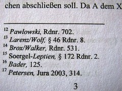 <p>A small note at the bottom of a page that gives extra information or sources about something in the text.</p>