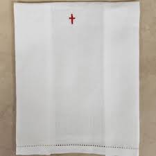 <p>white linen cloth used by priest or deacon to wipe and dry the chalice, has a small cross where the cloth folds</p>