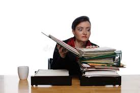 <p>She is handling a stack of papers.</p>