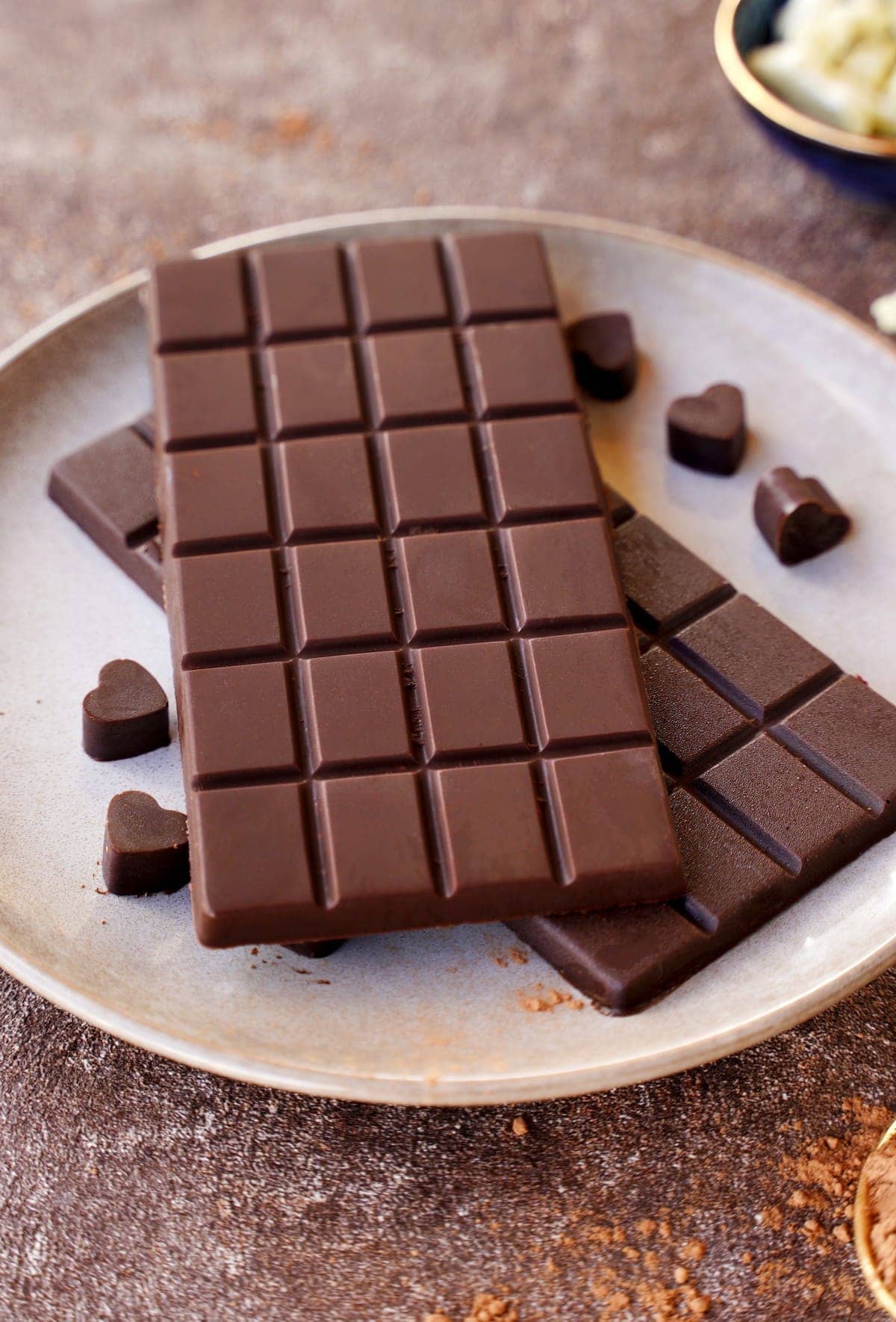 <p>A food in the form of a paste or solid block made from roasted and ground cacao seeds.</p>