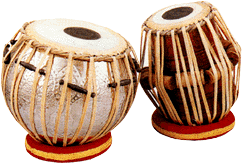 <ul><li><p>pair of drums with black center</p></li><li><p>similar to indian tambura</p></li></ul><p></p>