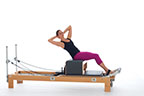 <p><strong>Setup</strong></p><ul><li><p>Starting in Flat Back position (page 31)</p></li><li><p>Resistance: <strong>all springs attached to hold carriage in place</strong></p></li></ul><p><strong>Movement</strong></p><ul><li><p>Inhale: Rotate trunk, lower trunk diagonally back</p></li><li><p>Exhale: Rotate to opposite side, lift trunk to center rotate to front, return to start position</p></li><li><p>Alternate sides</p></li></ul><p><strong>Muscle Focus</strong></p><ul><li><p>Spinal rotators</p></li><li><p>Spinal flexors</p></li><li><p>Spinal extensors</p></li><li><p>Hip flexors</p></li></ul><p><strong>Objectives</strong></p><ul><li><p>Spinal rotator strength</p></li><li><p>Trunk stabilization</p></li><li><p>Hip flexor strength</p></li></ul><p><strong>Cues</strong></p><ul><li><p>Maintain co-contraction of abdominals and back extensors</p></li><li><p>Keep both sit bones in contact with box</p></li><li><p>Rotate on longitudinal axis prior to hinging diagonally back</p></li><li><p>Return to longitudinal axis prior to facing front</p></li></ul><p></p>