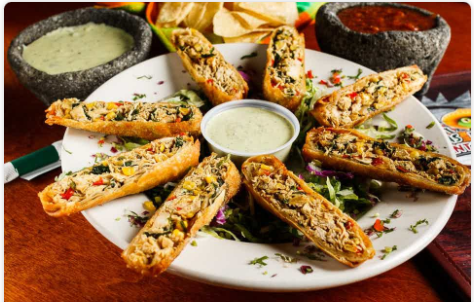 <p>(8pc.) Stuffed with chicken, corn, spinach, and poblano peppers. Deep-fried until golden brown and served with a tasty cilantro sauce.</p>