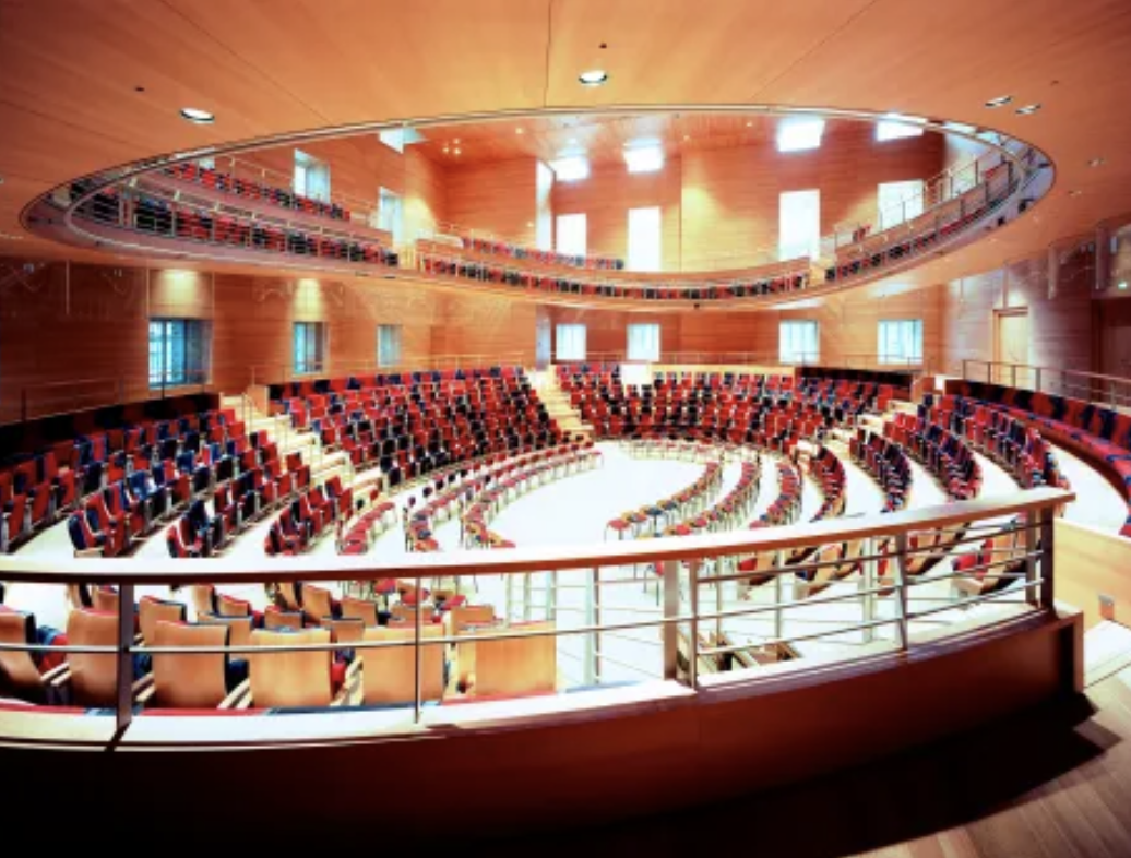 <p>Berlin, Pierre Boulez Saal, 2017, Frank Gehry</p><ol><li><p><span><strong>Intimate 360-Degree Design:</strong> Frank Gehry designed the hall as an intimate "living room" featuring a hovering, column-free balcony, where no seat is far from the stage, creating a unique communal experience between audience and musicians.</span></p></li><li><p><span><strong>Acoustic and Structural Flexibility:</strong> The hall features modular seating and staging that can be reconfigured for different musical formats without disrupting the exceptional acoustics created by Toyota.</span></p></li><li><p><span><strong>Cultural Dialogue and Symbolism:</strong> As part of the Barenboim-Said Akademie, the 2017 hall serves as a, architectural vessel for Daniel Barenboim’s vision of fostering peace and dialogue through music, specifically hosting musicians from the Middle East.</span></p></li></ol><p></p>