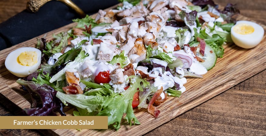<p>Chicken Breast, Baby Lettuce, Cherry Tomatoes, Cucumber, Sweet Onion, Whole Egg, BACON, Blue Cheese Crumbles, Buttermilk Ranch Dressing</p>