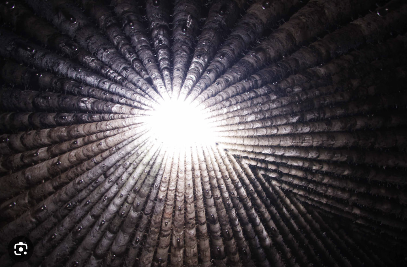<p>Eiffel, Germany; Bruder Klaus Field Chapel; Peter Zumthor; 2007</p><ol><li><p>It <span>was created by pouring concrete around a stacked timber wigwam, which was then burned for three weeks to create a charred, pitch-black interior.</span></p></li><li><p><span>The chapel is a profound exploration of materiality and atmosphere, using an open oculus to allow rain and sunlight to enter, fostering a deeply contemplative, meditative space that connects visitors to the natural elements.</span></p></li><li><p><span>Built by local farmers to honor their patron saint, Bruder Klaus, the 12-meter-high concrete tower is a landmark of contemporary religious architecture that contrasts a rigid, angular exterior with a soft, organic interior shaped by fire</span></p></li></ol><p></p>