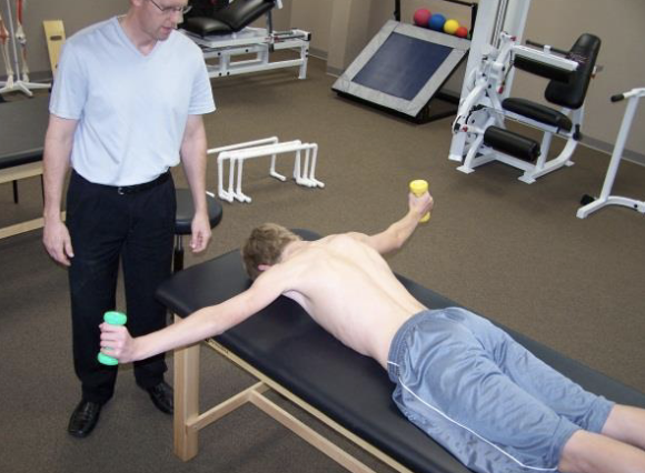 <p>The subject is prone, with the shoulders resting in 90° forward flexion. From this position the subject performs bilateral horizontal abduction to horizontal position, with an additional external rotation of the shoulders at the end of the movement.</p><p>Note: High infraspinatus activity, low UT/ LT ratio. MT and LT active prior to PD and UT. Would not start day 1</p>