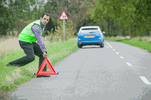 <p>You've broken down on a two-way road. You have a warning triangle. At least how far from your vehicle should you place the warning triangle?</p>