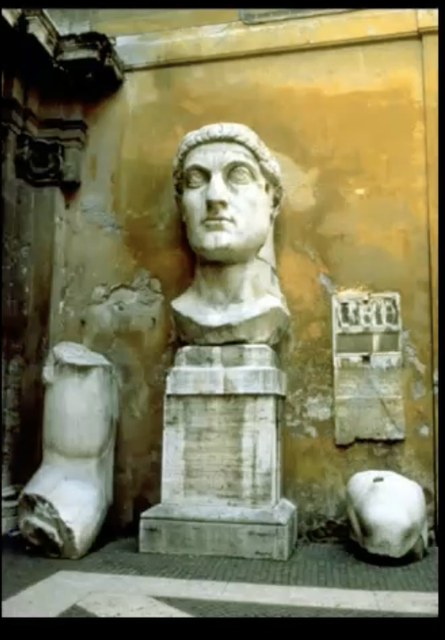 <p>-a marble sculpture, over 8'5 ft( super extra large compared to a human), </p><p>-only what remains is sort of the elbow and bicep of Constantine; </p><p>-a depiction of the emperor in a seated or enthroned position </p>