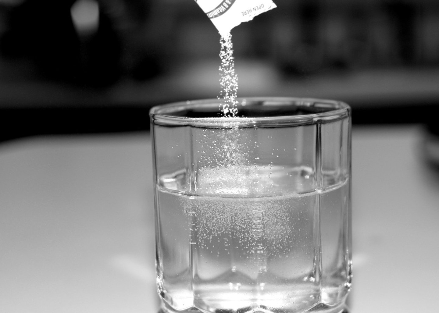 <p>to completely incorporate a dry ingredient into a liquid so that they form a solution</p>