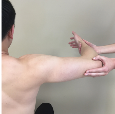 <p>sat, humerus supported in 90 abduction. elbow starts flexed</p><p>“try to straighten your elbow”</p>