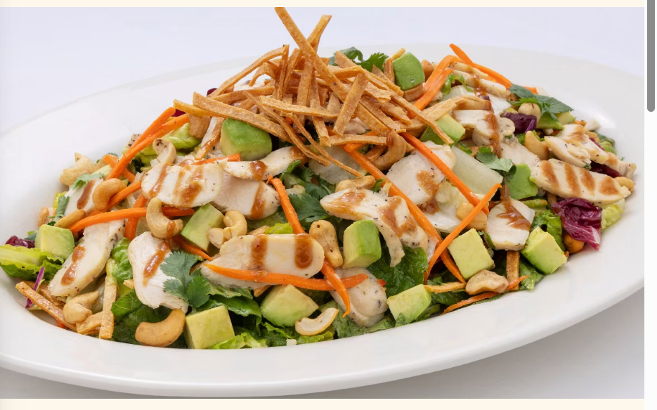 <p>Chicken Breast, Fresh Avocado, Mixed Greens, Crisp Tortilla Strips, Carrots, Cilantro and Cashews Tossed in a Citrus-Honey-Peanut Vinaigrette</p>