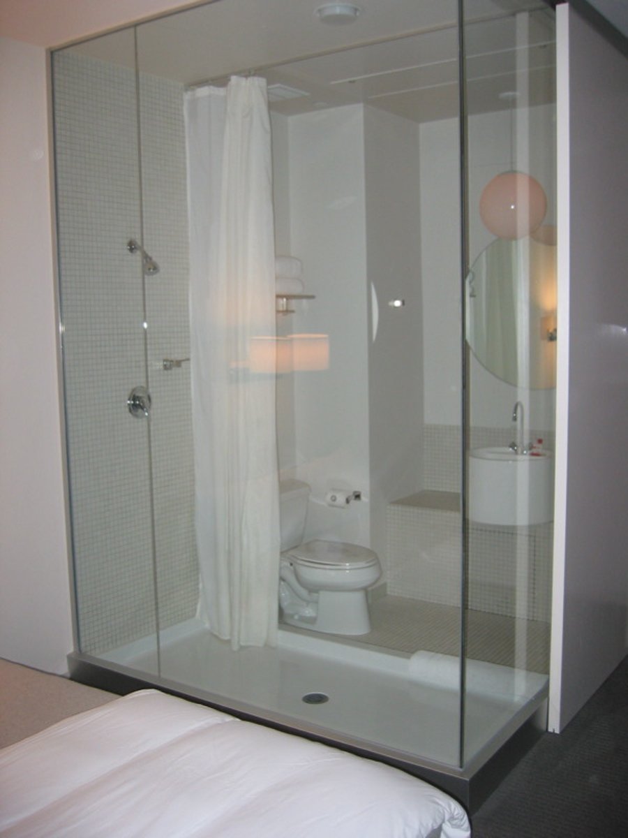 <p>An enclosed area in a bathroom where a person stands under a spray of water to wash.</p><p>Example: Our flat has a small shower cabin instead of a full bathtub.</p>