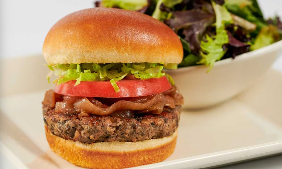 <p>Combined with Fresh Mushrooms, Garlic and Spices. Served with Grilled Onions, Lettuce, Tomato, Mayo and a Green Salad</p>