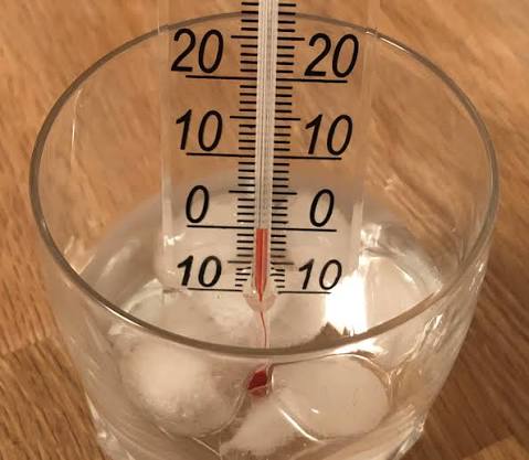 The temperature at which a solid begins to liquefy.