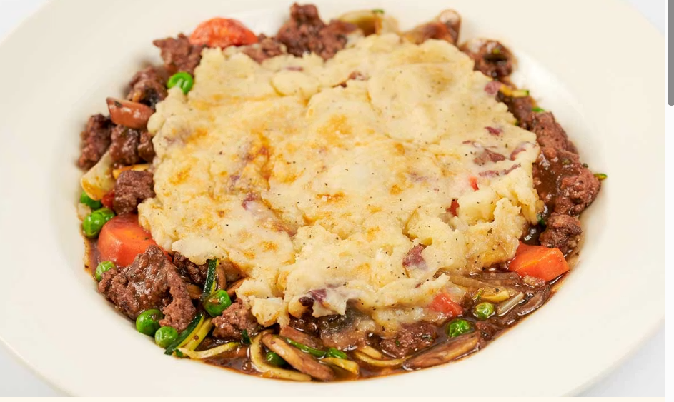 <p>Ground Beef, Carrots, Peas, Zucchini and Onions in a Delicious Mushroom Gravy Covered with a Mashed Potato-Parmesan Cheese Crust</p>