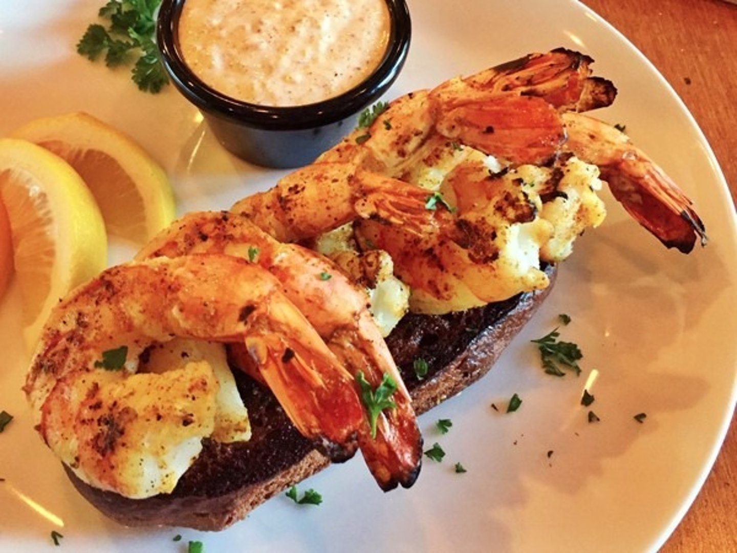 <p>8 seasoned grilled shrimp (6 at lunch) with a special blend of herbs and spices. Served with house-made garlic toast and classic remoulade sauce.</p>