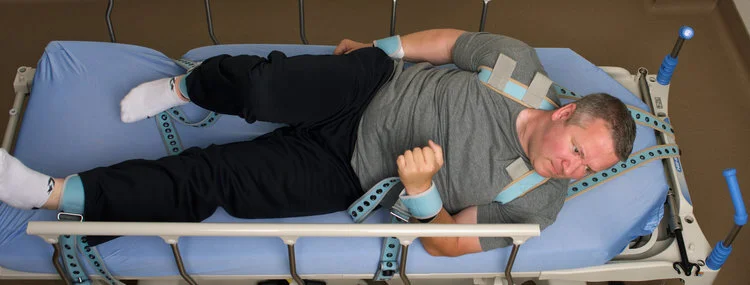 <p>Any device, material, or manual method that limits a client's ability to move their body or head freely.</p>
