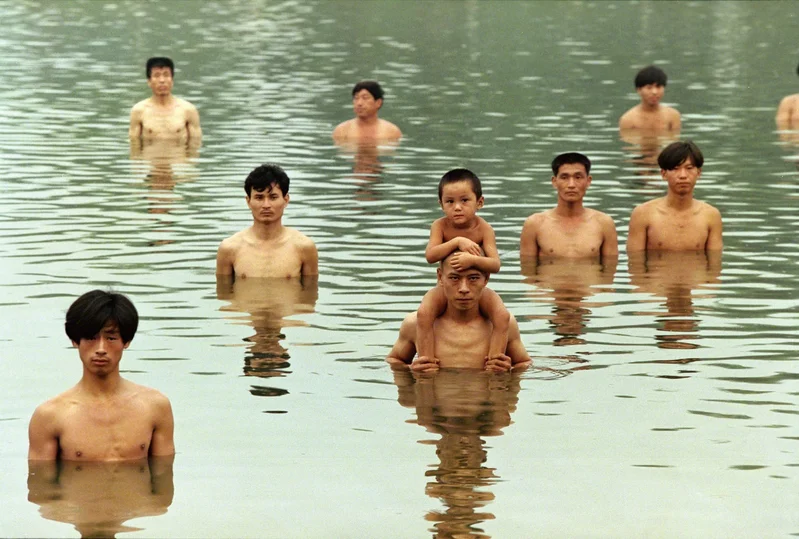 <p>Zhang Huan & Rong Rong, <em>To Raise the Water Level in a Fishpond,</em> 1997</p>