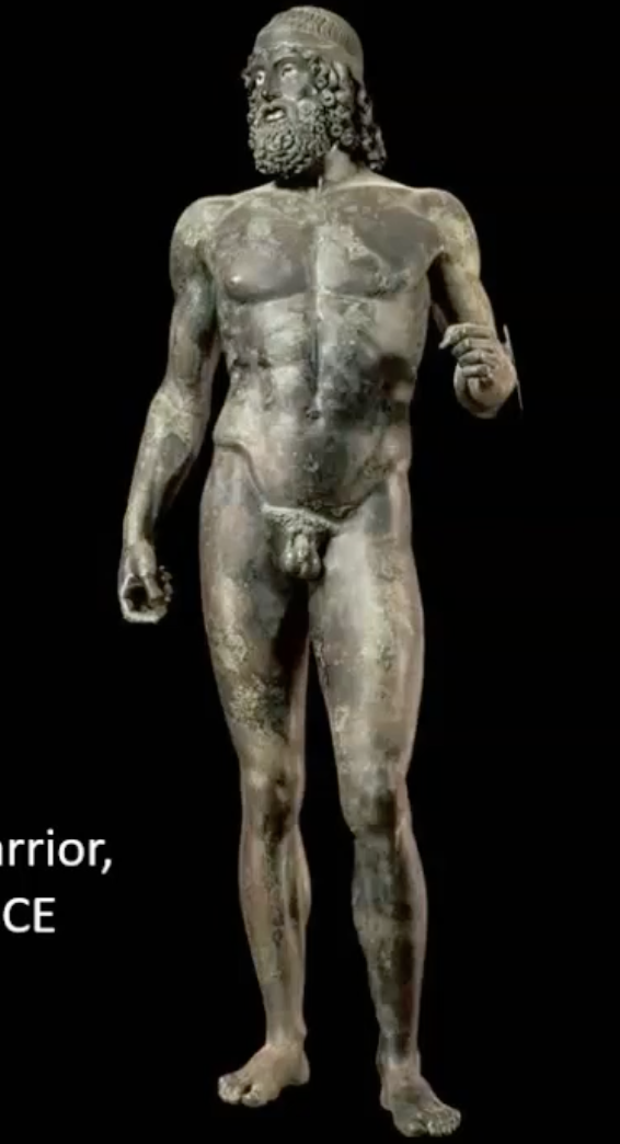 <p>-bronze statue, a warrior, 6'5 ft height,weigh as much as a car</p><p>-he would have originally been holding a shield and a sword in his clenched hands, wearing a helmet on his head. </p><p>-representative of a mature powerful male.</p><p>-the physique is a bit more buffed out, he's got a full beard, but look at that contrapposto stance.</p><p>->it's been fully integrated into Greek arts by the time we're at this Early Classical period here post sacking of Athens </p>