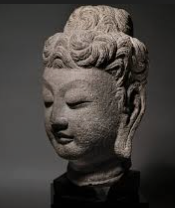 <p>a knot of hair on the top of the head; one of the lakshanas of the Buddha</p>