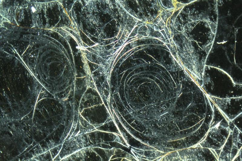 <p>Concentric fracture pattern resulting from contraction on cooling of certain volcanic glasses. </p>